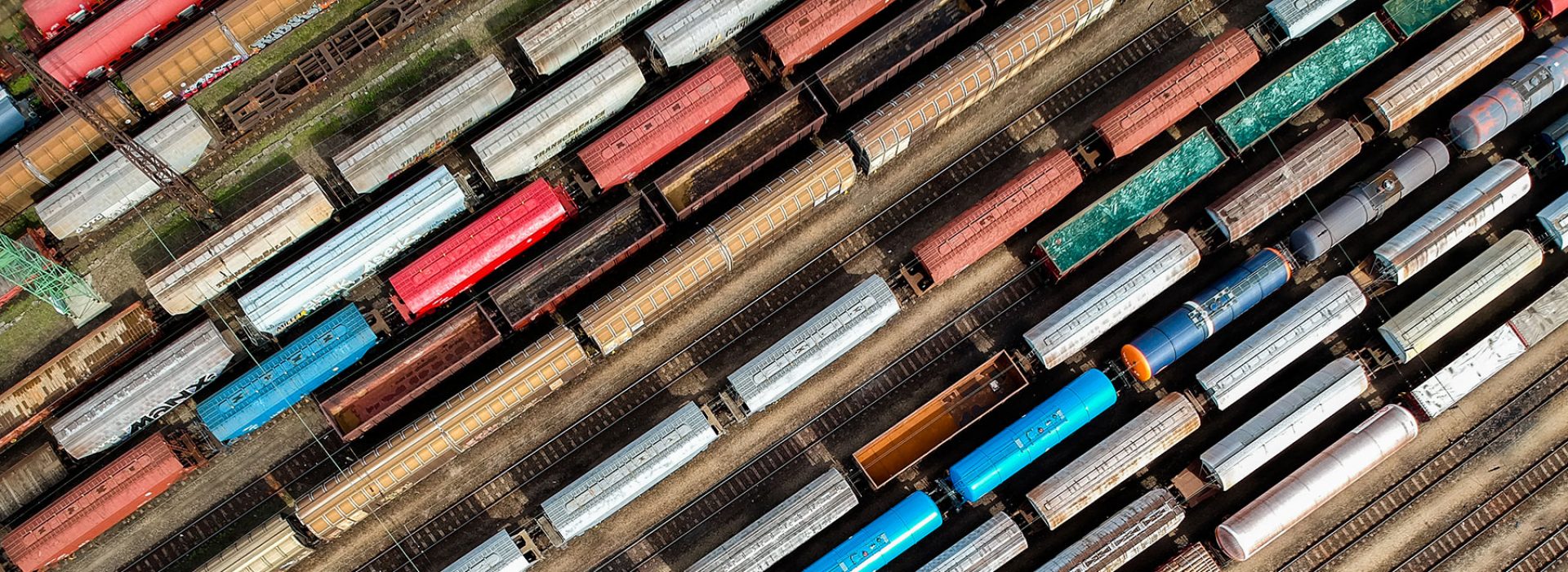 An aerial view of many trains in a trainyard